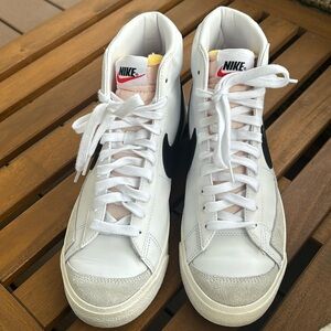 Nike blazers mid ‘77. Leather upper. Size 10 Women. White w/black Nike swoosh.